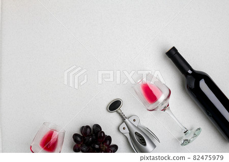Wine, glasses and corkscrew over white background. Top view Wine, glasses and corkscrew over white background. Top view 82475979