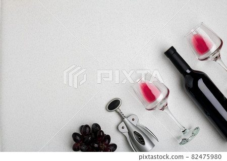 Wine, glasses and corkscrew over white background. Top view Wine, glasses and corkscrew over white background. Top view 82475980
