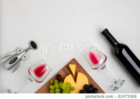 Wine, glasses and corkscrew over white background. Top view Wine, glasses and corkscrew over white background. Top view 82475988