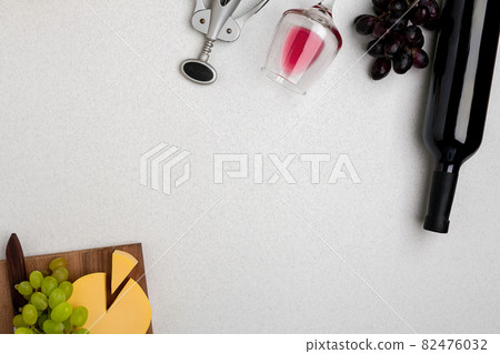 Wine, glasses and corkscrew over white background. Top view 82476032