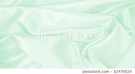 Smooth elegant green silk or satin luxury cloth texture as abstract background. Luxurious background design Smooth elegant green silk or satin luxury cloth texture as abstract background. Luxurious background design 82476829