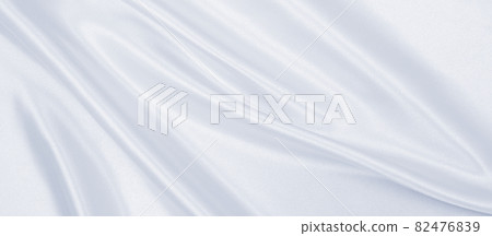 Smooth elegant grey silk or satin luxury cloth as wedding background. Luxurious background design Smooth elegant grey silk or satin luxury cloth as wedding background. Luxurious background design 82476839