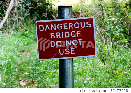Dangerous Bridge Sign in a Woodland Location Dangerous Bridge Sign in a Woodland Location 82477928