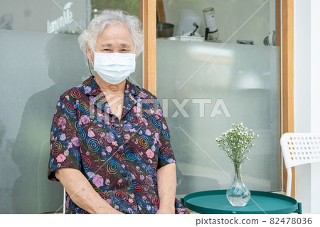 Asian senior or elderly old lady woman patient wearing a face mask new normal in hospital for protect safety infection Covid-19 Coronavirus. Asian senior or elderly old lady woman patient wearing a face mask new normal in hospital for protect safety infection Covid-19 Coronavirus. 82478036