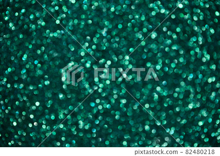 Green abstract background with bokeh. Sparkling glitter texture. Green abstract background with bokeh. Sparkling glitter texture. 82480218