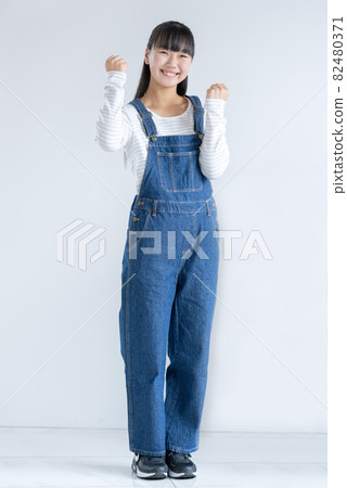 Full body portrait of a girl on a white background 82480371