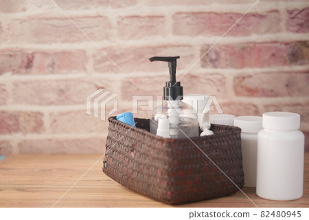 close up of many hand sanitizer in a box on table  82480945