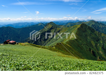 Blue sky and mountains of Tanigawa mountain range, shoulder hut 82482375