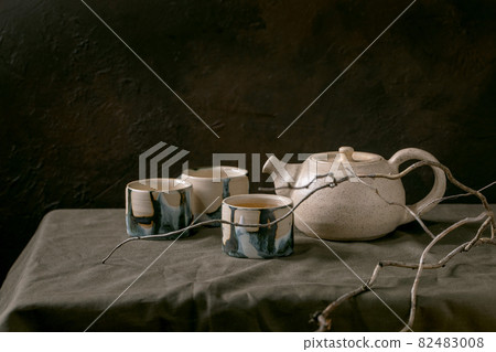 Craft handmade ceramic teapots with dark background Craft handmade ceramic teapots with dark background 82483008