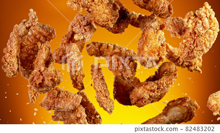 Freeze motion of flying pieces of fried chicken pieces Freeze motion of flying pieces of fried chicken pieces 82483202