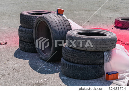 Used car tires stacked on the race track 82483724