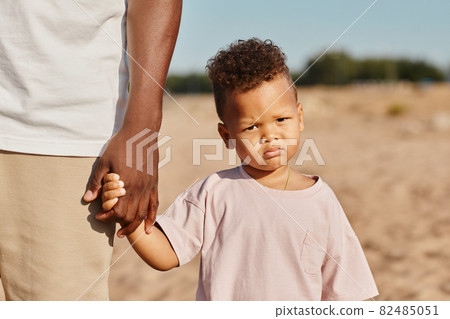 Cute Boy with Dad at Beach 82485051