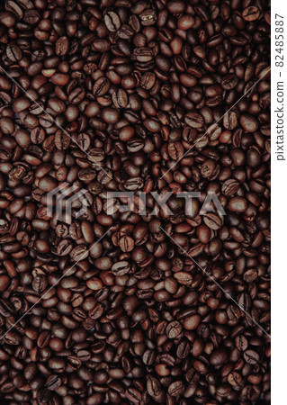 Aromatic coffee beans with background. Vertical image Aromatic coffee beans with background. Vertical image 82485887