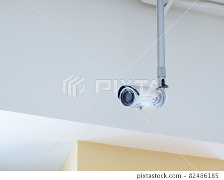 Small CCTV camera security mounted on the ceiling. Small CCTV camera security mounted on the ceiling. 82486185