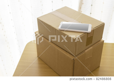 Smartphones and cardboard. Mail order, resale, side business, online business image Smartphones and cardboard. Mail order, resale, side business, online business image 82486808