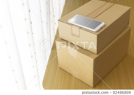 Smartphones and cardboard. Mail order, resale, side business, online business image Smartphones and cardboard. Mail order, resale, side business, online business image 82486809