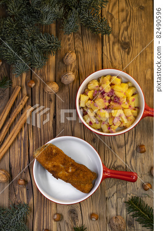 Traditional Christmas dinner in Czech Republic - carp fillet with potato salad Traditional Christmas dinner in Czech Republic - carp fillet with potato salad 82490596