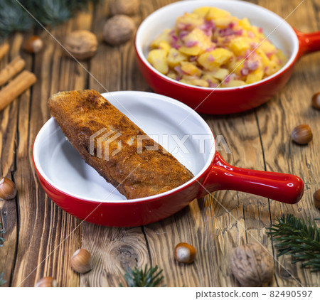 Traditional Christmas dinner in Czech Republic - carp fillet with potato salad Traditional Christmas dinner in Czech Republic - carp fillet with potato salad 82490597
