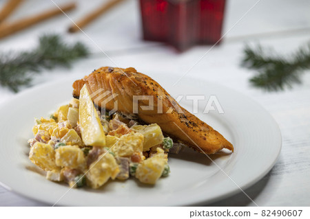 Traditional Christmas dinner in Czech Republic - salmon fillet with potato salad 82490607