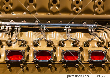 Close-up of a detail of a rare car engine. Metal mechanisms. Automotive industry 82491729