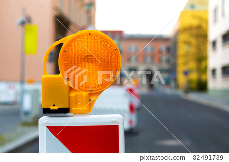Closed street. Fencing with flashing lights. Road works Closed street. Fencing with flashing lights. Road works 82491789