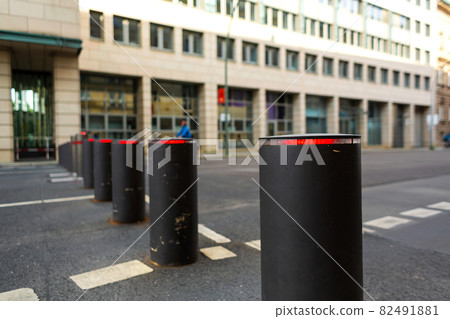 Automatic lifting bollards restricting the driveway of vehicles Automatic lifting bollards restricting the driveway of vehicles 82491881