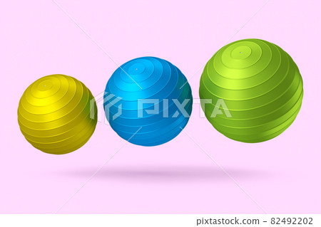 Multicolor fitball or fitness ball for yoga exercise isolated pink background Multicolor fitball or fitness ball for yoga exercise isolated pink background 82492202