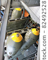 Bombs loaded on fighter planes 82492528
