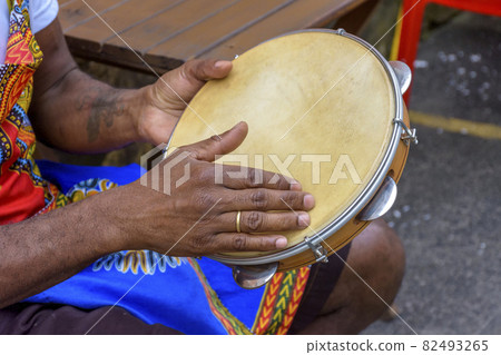 Brazilian samba performance with musician hands playing tambourine Brazilian samba performance with musician hands playing tambourine 82493265