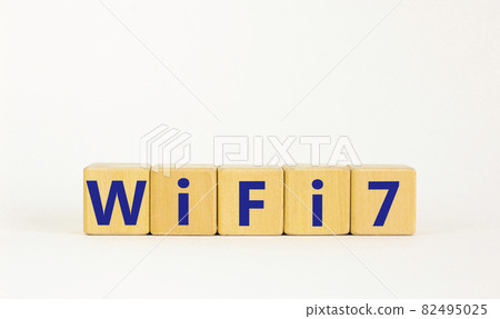 WiFi 7 symbol. The concept word WiFi 7 on wooden cubes. Beautiful white table, white background, copy space. Business, technology and WiFi 7 or WiFi7 concept. WiFi 7 symbol. The concept word WiFi 7 on wooden cubes. Beautiful white table, white background, copy space. Business, technology and WiFi 7 or WiFi7 concept. 82495025