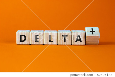Covid-19 delta plus variant symbol. Turned the wooden cube and changed words Delta to Delta plus. Beautiful orange background. Copy space. COVID-19 new delta plus variant concept. Covid-19 delta plus variant symbol. Turned the wooden cube and changed words Delta to Delta plus. Beautiful orange background. Copy space. COVID-19 new delta plus variant concept. 82495188