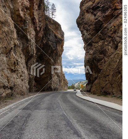 Scenic Road in the rocky canyon cliffs by Canadian Mountains. 82496305