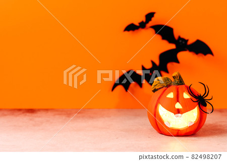 Happy halloween holiday concept. Halloween handmade paper decorations, spiders, ghosts in car, bats, boo text on orange background. Halloween festival party, greeting card mockup with copy space 82498207