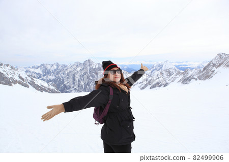 Snow covered mountain peak winter and tourist Snow covered mountain peak winter and tourist 82499906