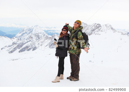 Snow covered mountain peak winter and tourist Snow covered mountain peak winter and tourist 82499908