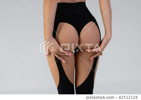 Faceless seductive woman with hands on buttocks Faceless seductive woman with hands on buttocks 82512128