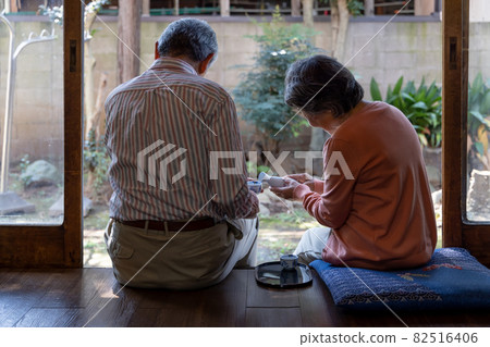 Country life: Senior couple enjoying alcohol from noon Country life: Senior couple enjoying alcohol from noon 82516406