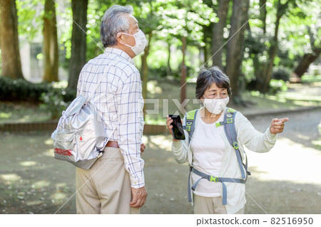 A senior couple heading to a designated evacuation facility A senior couple heading to a designated evacuation facility 82516950