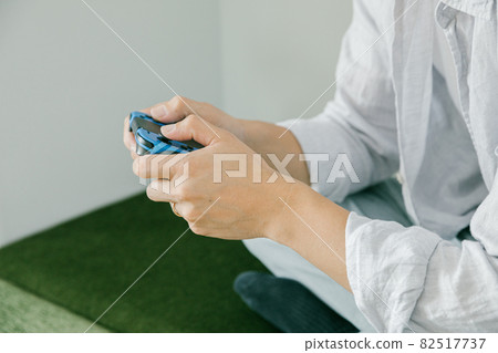 Men playing games in the room People who enjoy playing games 82517737