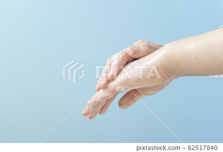 A child who washes his hands with soap. Girl's hand close-up. 82517840