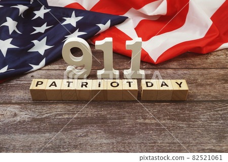 911 Patriot Day Word alphabet letters with USA flag on wooden background 82521061