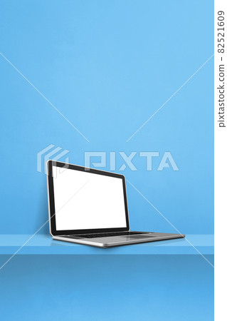 Laptop computer on blue shelf. Vertical background 82521609