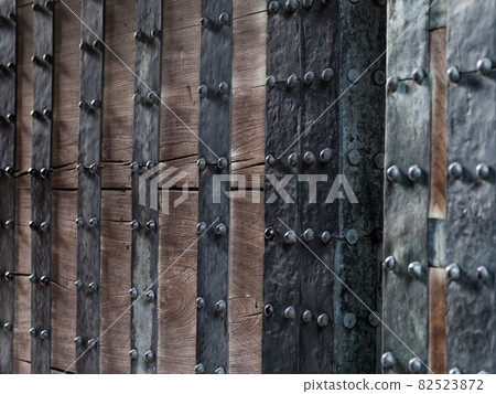 The gate of Edo Castle with beautiful wood grain and iron studs 82523872