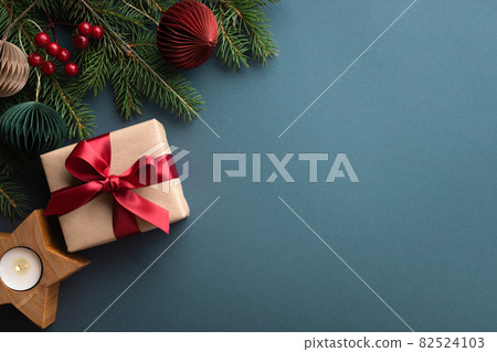 Dark turquoise background with Christmas gift box. Dark turquoise background with Christmas gift box. 82524103