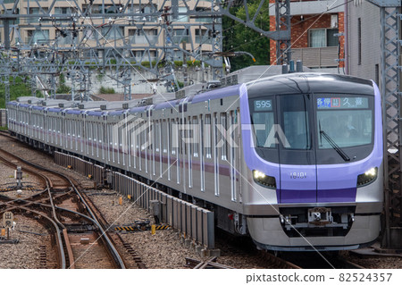 Tokyo Metro 18000 series 1st train going on a gentle curve on the Denen-toshi line Tokyo Metro 18000 series 1st train going on a gentle curve on the Denen-toshi line 82524357