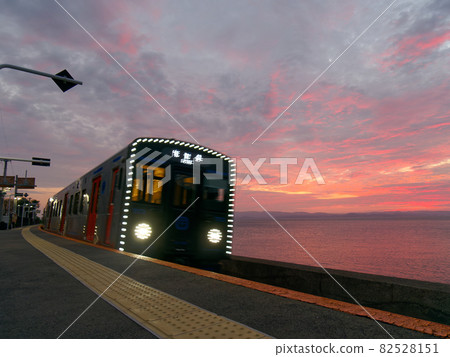 YC1 series railcars on the Omura Line passing through Chiwata Station at dusk YC1 series railcars on the Omura Line passing through Chiwata Station at dusk 82528151