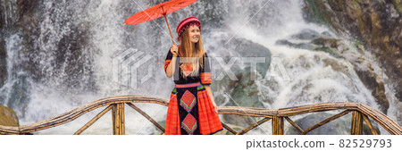 BANNER, LONG FORMAT female tourist dressed in the traditional dress of the inhabitants of the Vietnamese mountains, the Hmong. Woman in Sapa in the fog, Northwest Vietnam. Vietnam travel concept BANNER, LONG FORMAT female tourist dressed in the traditional dress of the inhabitants of the Vietnamese mountains, the Hmong. Woman in Sapa in the fog, Northwest Vietnam. Vietnam travel concept 82529793