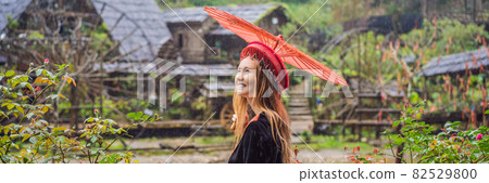 BANNER, LONG FORMAT female tourist dressed in the traditional dress of the inhabitants of the Vietnamese mountains, the Hmong. Woman in Sapa in the fog, Northwest Vietnam. Vietnam travel concept BANNER, LONG FORMAT female tourist dressed in the traditional dress of the inhabitants of the Vietnamese mountains, the Hmong. Woman in Sapa in the fog, Northwest Vietnam. Vietnam travel concept 82529800