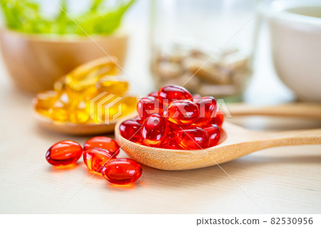 Alternative medicine herbal organic capsule with vitamin E omega 3 fish oil, mineral, drug with herbs leaf natural supplements for healthy good life. 82530956