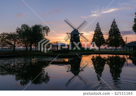 Sunrise from a park with a windmill Sunrise from a park with a windmill 82531165